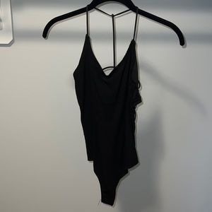 Open back cool detailing thing bodysuit in black. Built in bra